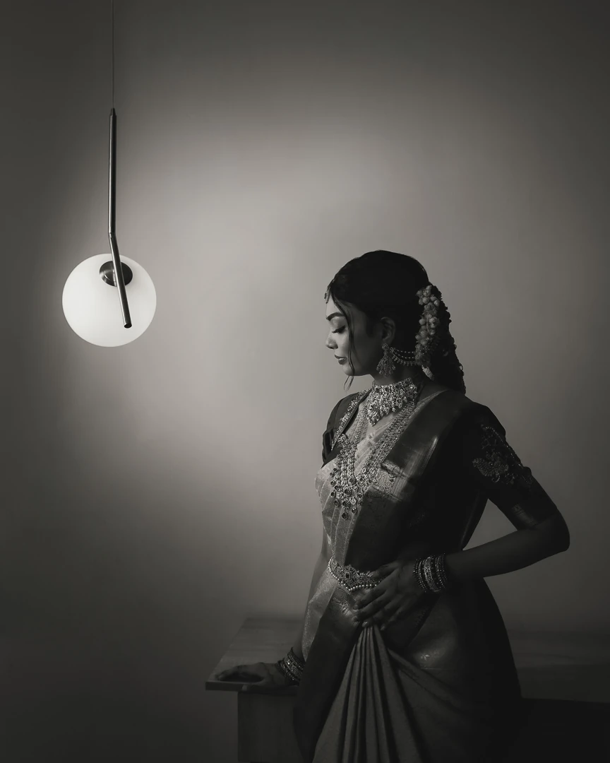Karu Studio bridal portrait beneath a pendant light